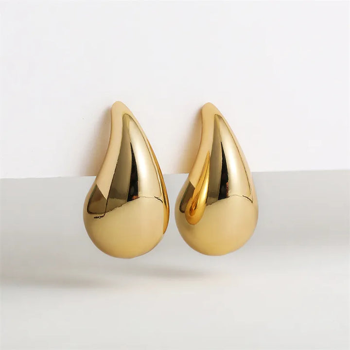 Glamorous gold plated crystal drop earrings for women, ideal for special occasions & evening wear.