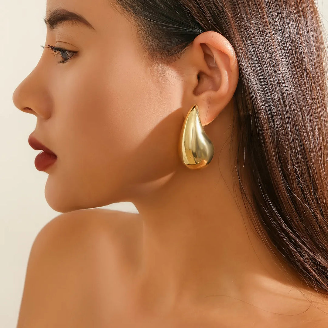 Stylish gold plated drop earrings for women, adorned with dazzling crystals, for a sophisticated touch.