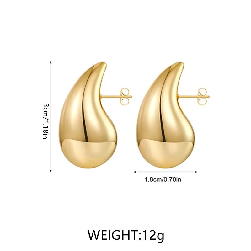 Women's elegant gold plated drop earrings, set with sparkling crystals, enhancing any outfit beautifully.