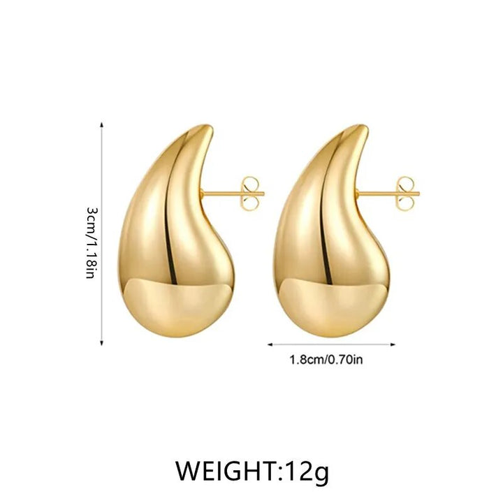 Women's elegant gold plated drop earrings, set with sparkling crystals, enhancing any outfit beautifully.