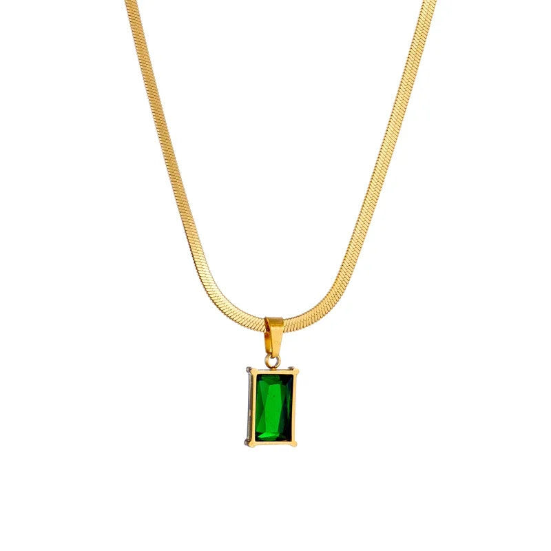 Pair of chic gold plated drop earrings with sparkling emerald green stones, perfect for women's fashion.