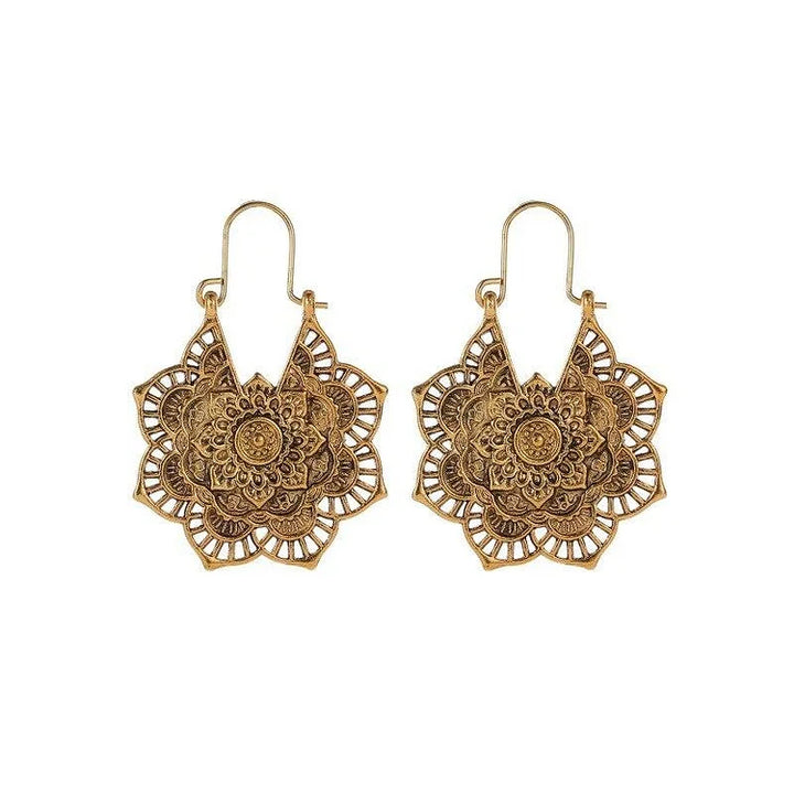 Beautiful gold & silver lotus mandala earrings for women. Hypoallergenic spiritual jewelry with a stylish boho chic design.