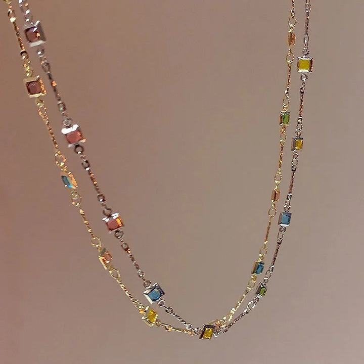 Elegant women's gold & silver necklace with vibrant colorful stones, a versatile and delicate jewelry accessory.