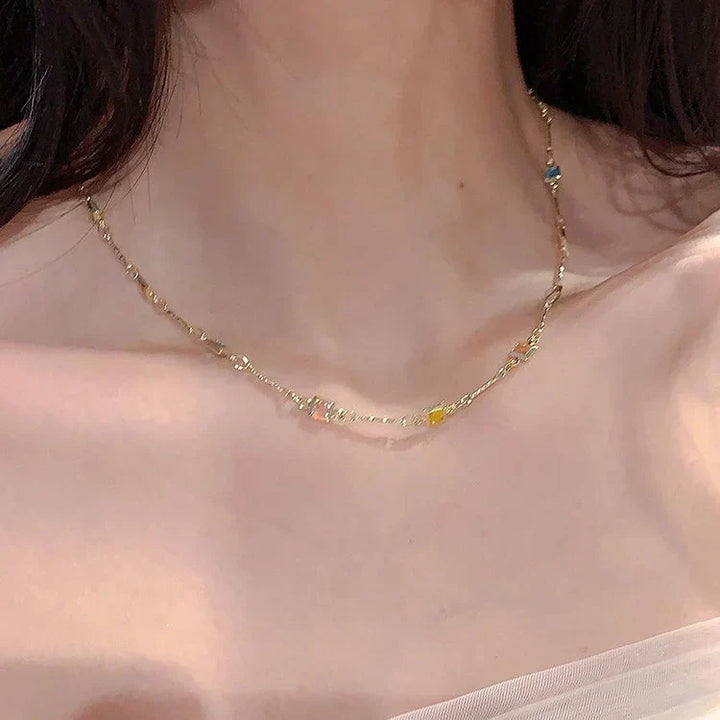 Delicate women's gold & silver necklace with a dazzling display of colorful stones. Perfect elegant gift for women.