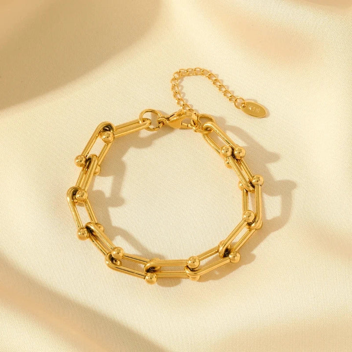 Women's elegant gold chain link jewelry, a stylish fashion accessory with intricate link design.