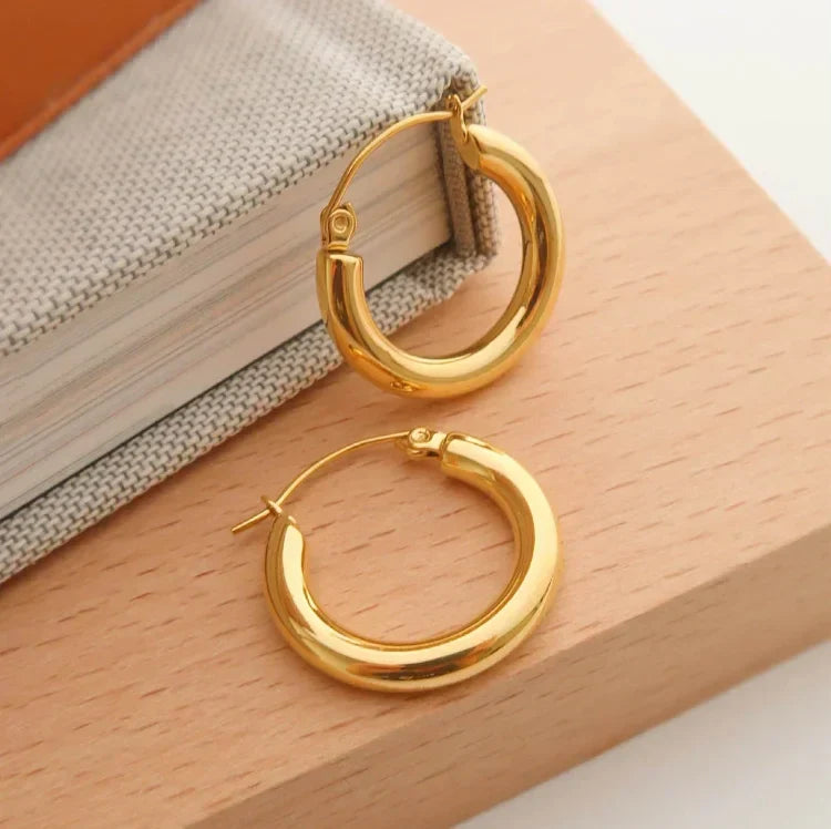Versatile gold hoop earrings for women, Aurélie collection. A stylish fashion accessory, perfect for everyday elegance.