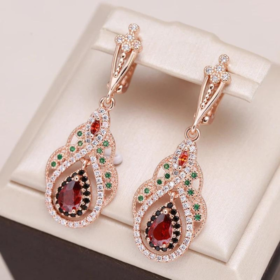 Elegant women's golden mandala earrings with sparkling red zirconia, perfect spiritual accessory. Kylie jewelry.