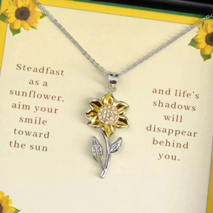 Golden sunflower necklace, a thoughtful gift for women. Features a detailed floral pendant & adjustable gold-tone chain.