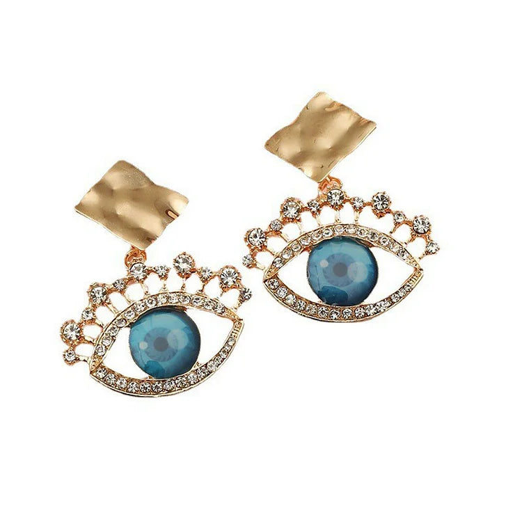 Women's vintage gold evil eye drop earrings featuring clear rhinestones, elegant and protective.