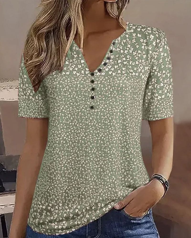 Chic women's comfortable floral summer blouse in green, a stylish relaxed-fit top for casual elegance.