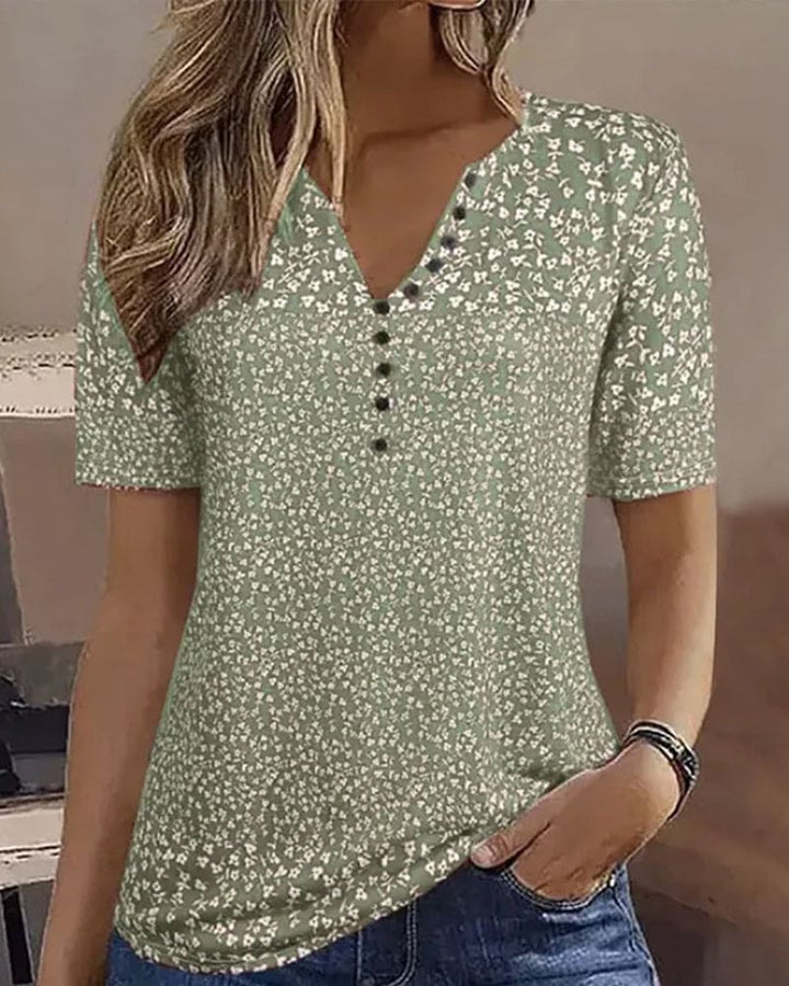 Chic women's comfortable floral summer blouse in green, a stylish relaxed-fit top for casual elegance.