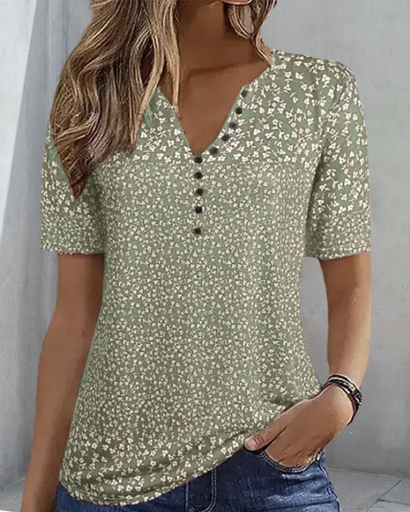 Stylish green floral women's blouse, an elegant and comfortable top for summer fashion and warm weather.