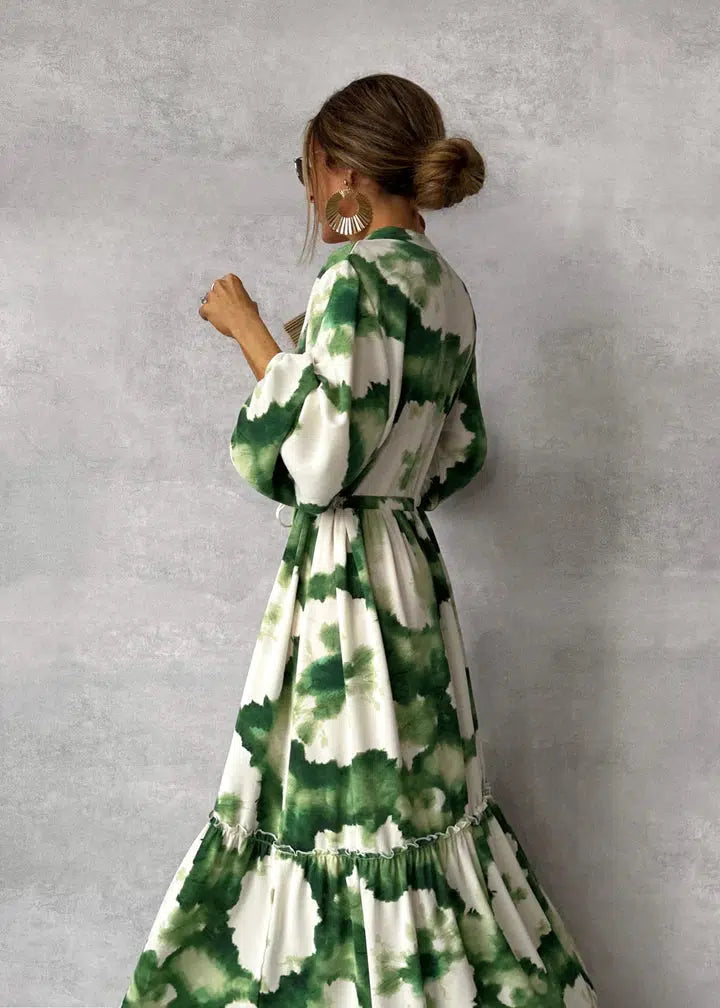 Modest & elegant women's green long-sleeve maxi dress with pointed neckline. Sophisticated for any occasion.