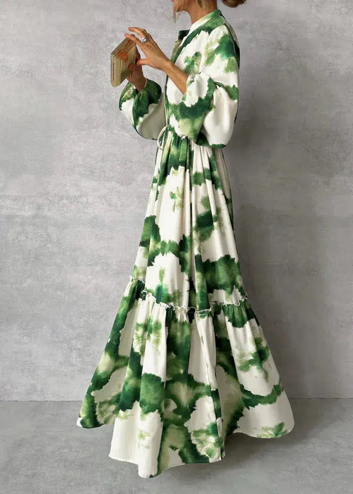 Chic green long-sleeve maxi dress for women. Elegant formal or party dress with a flattering pointed neckline.