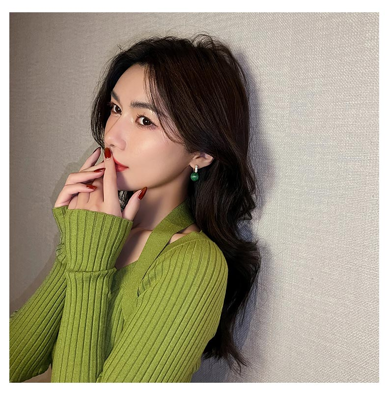 Luxury statement earrings for women, showcasing vibrant green pearls and elegant gold-plated design.
