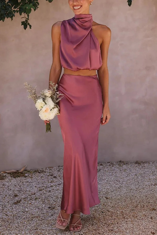 Chic women's 2-piece set featuring a halter crop top & a maxi skirt. Ideal for parties & wedding guests.