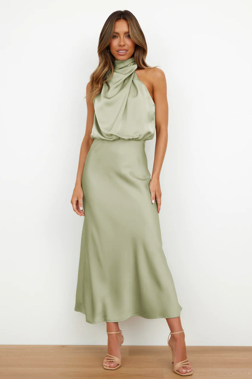 Elegant women's halter evening gown. Floor-length dress with a stylish open back, perfect for formal occasions.
