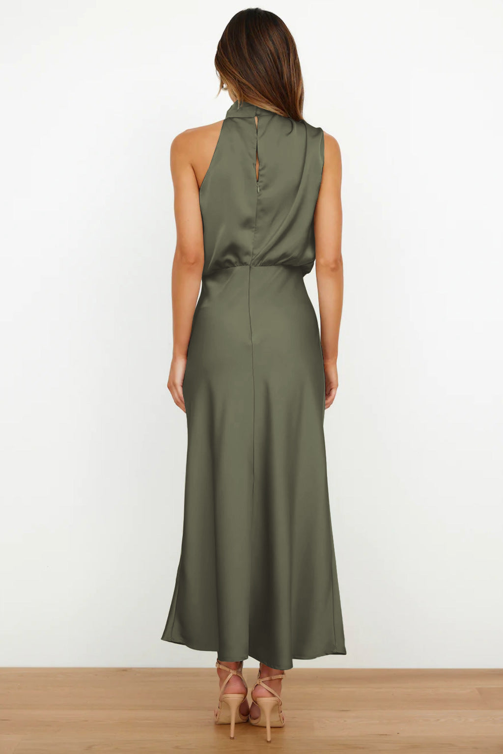 Graceful long halter evening gown. Open back design, perfect for women attending a gala or formal event.