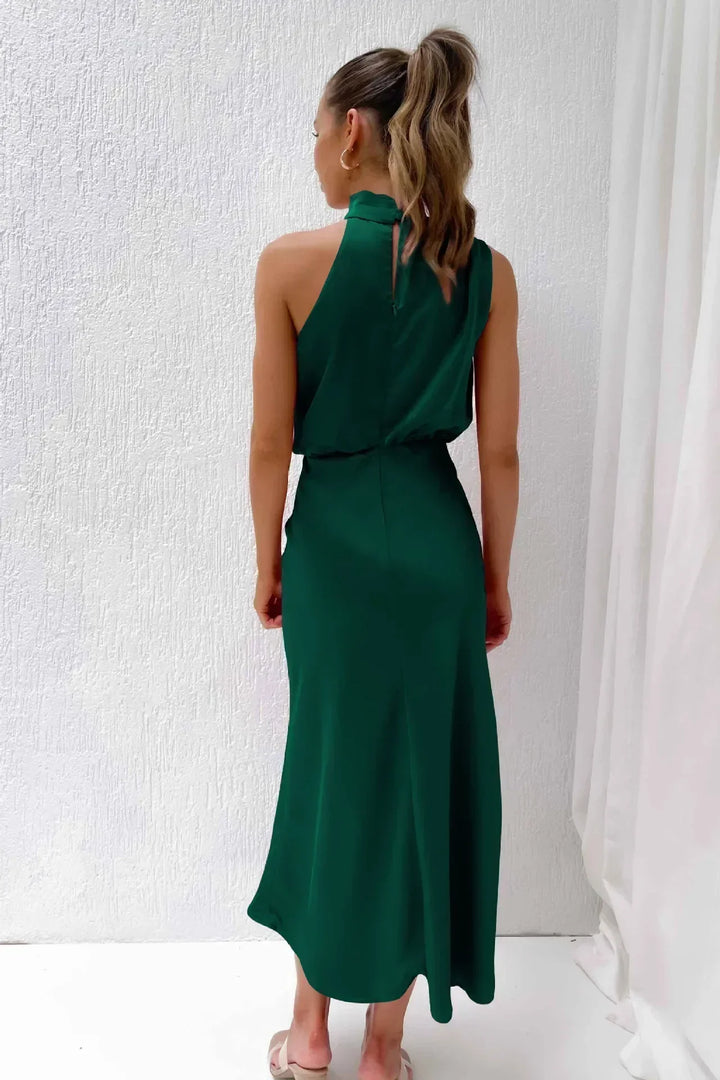 Formal women's open back halter dress. Long, elegant, and floor-length, ideal for galas or weddings.