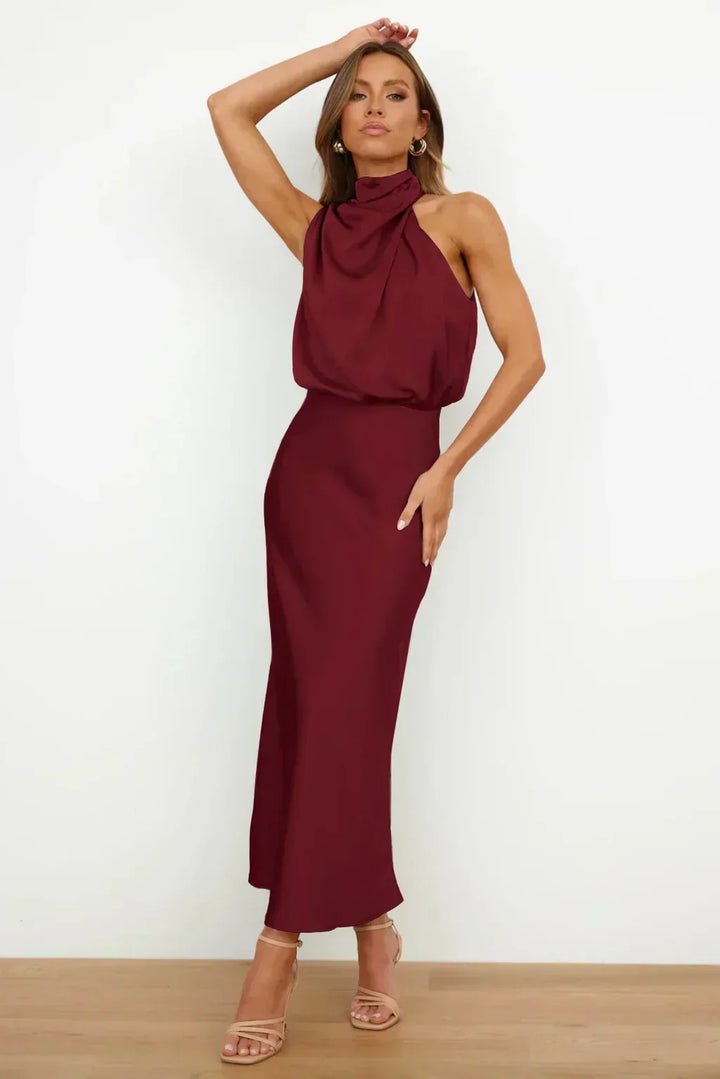 Elegant floor-length halter gown. Open back design, women's formal wear, perfect for any special event.
