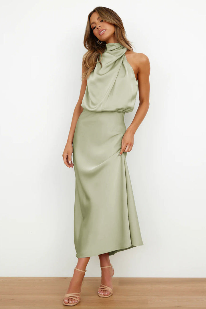 Women's formal halter dress. Long, open-back evening gown ideal for prom, galas, or wedding guests.