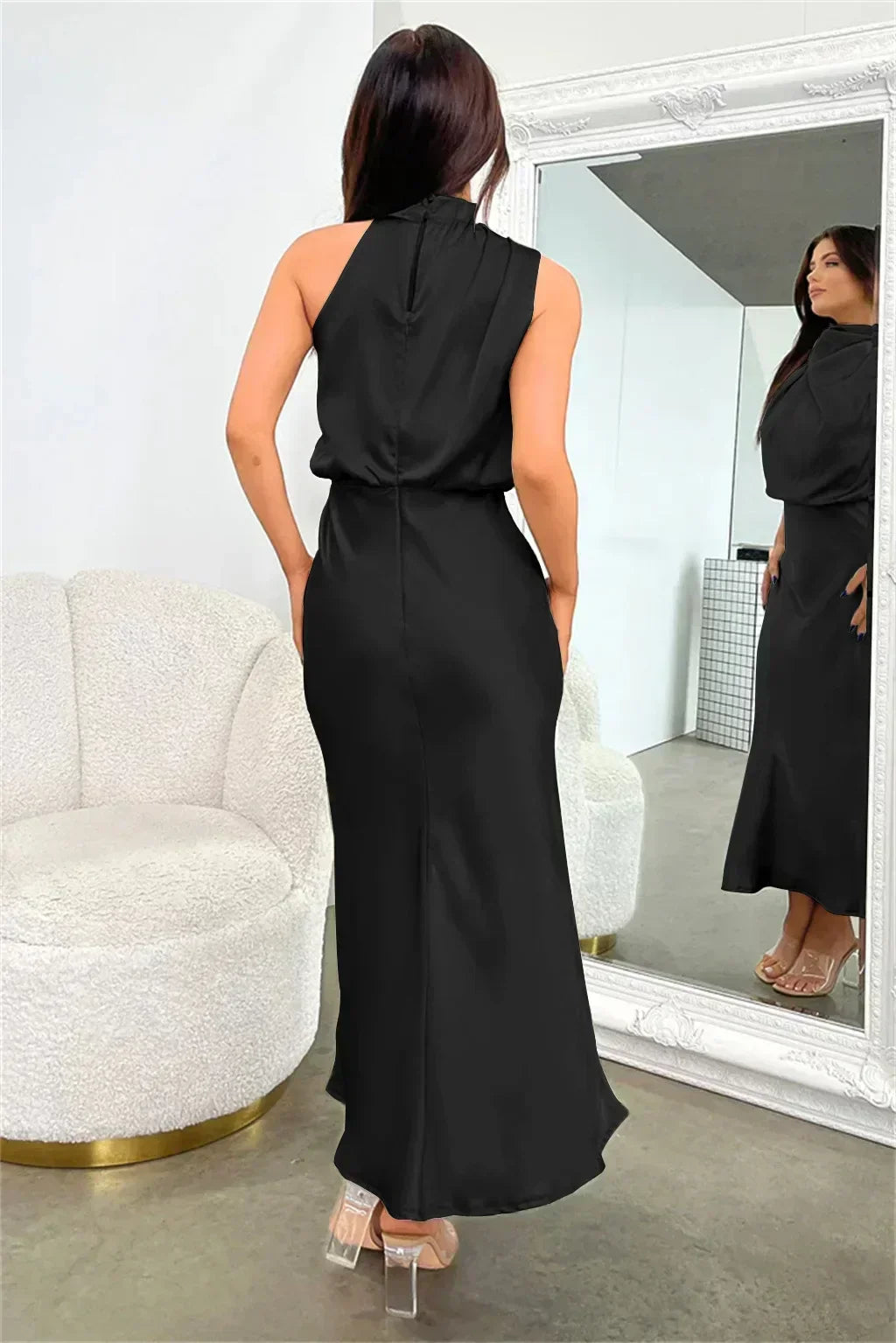 Sophisticated women's halter formal dress. Floor-length, open-back gown for elegant special occasions.