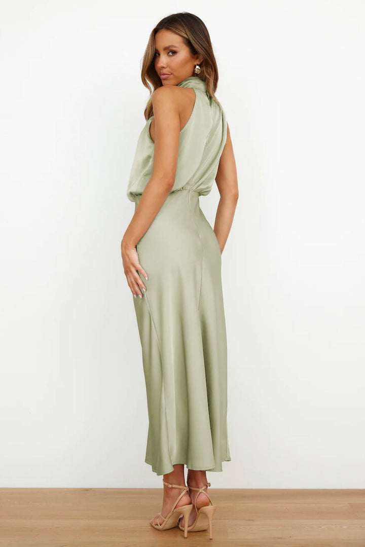 Stunning floor-length halter gown. Open back design for women's special occasion wear, very elegant.