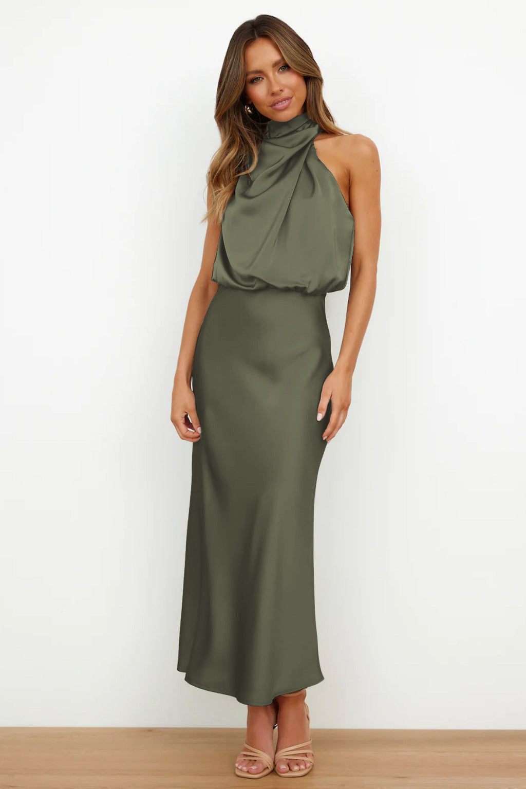 Women's special occasion halter dress. Long, floor-length, and stylish open back design for formal wear.