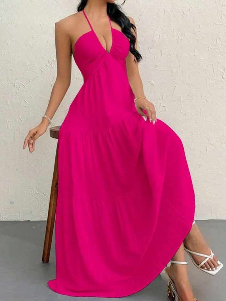 Sleeveless elegant women's halter maxi dress, featuring a beautiful flowing tiered skirt for a chic summer look.