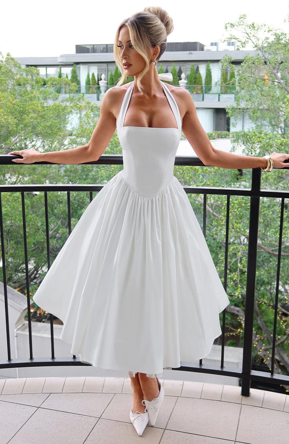 Elegant women's halter neck midi cocktail dress, perfect for special occasions & wedding guests.