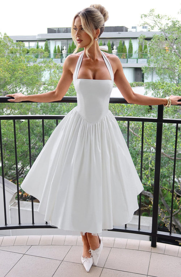 Elegant women's halter neck midi cocktail dress, perfect for special occasions & wedding guests.