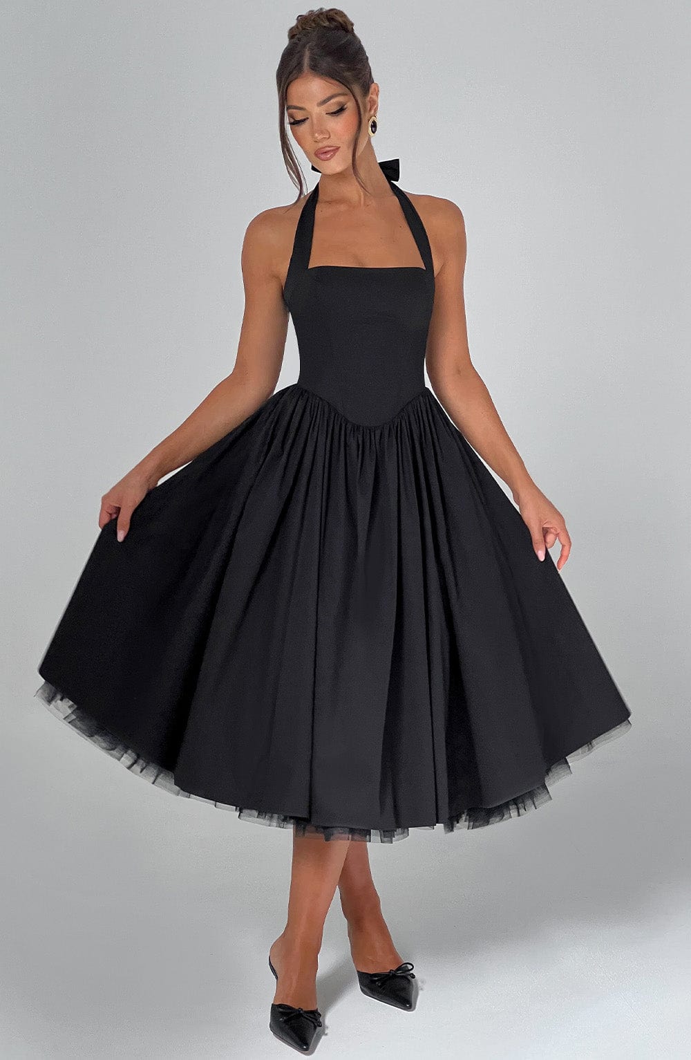 Vintage-inspired halter neck midi cocktail dress for women, offering an elegant event style.