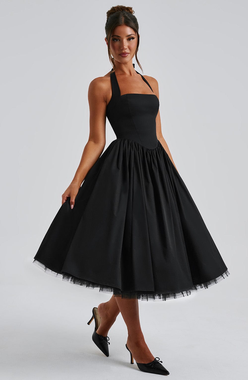 Elegant women's party dress: halter neck midi design, perfect for cocktails & wedding guests.