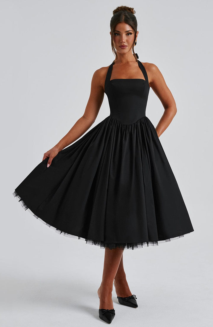Chic women's event wear: halter neck midi cocktail dress with a flattering silhouette.