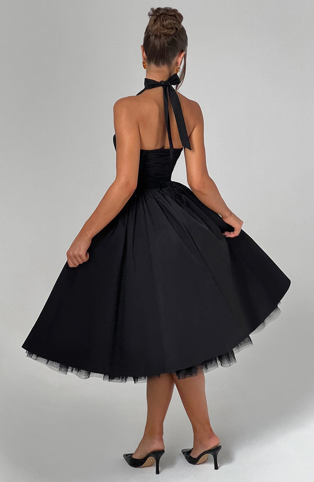 Stylish A-line halter neck midi dress for women, perfect as a cocktail or wedding guest dress.
