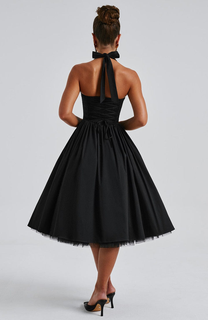 Women's elegant halter neck midi dress, a timeless choice for formal parties and special events.