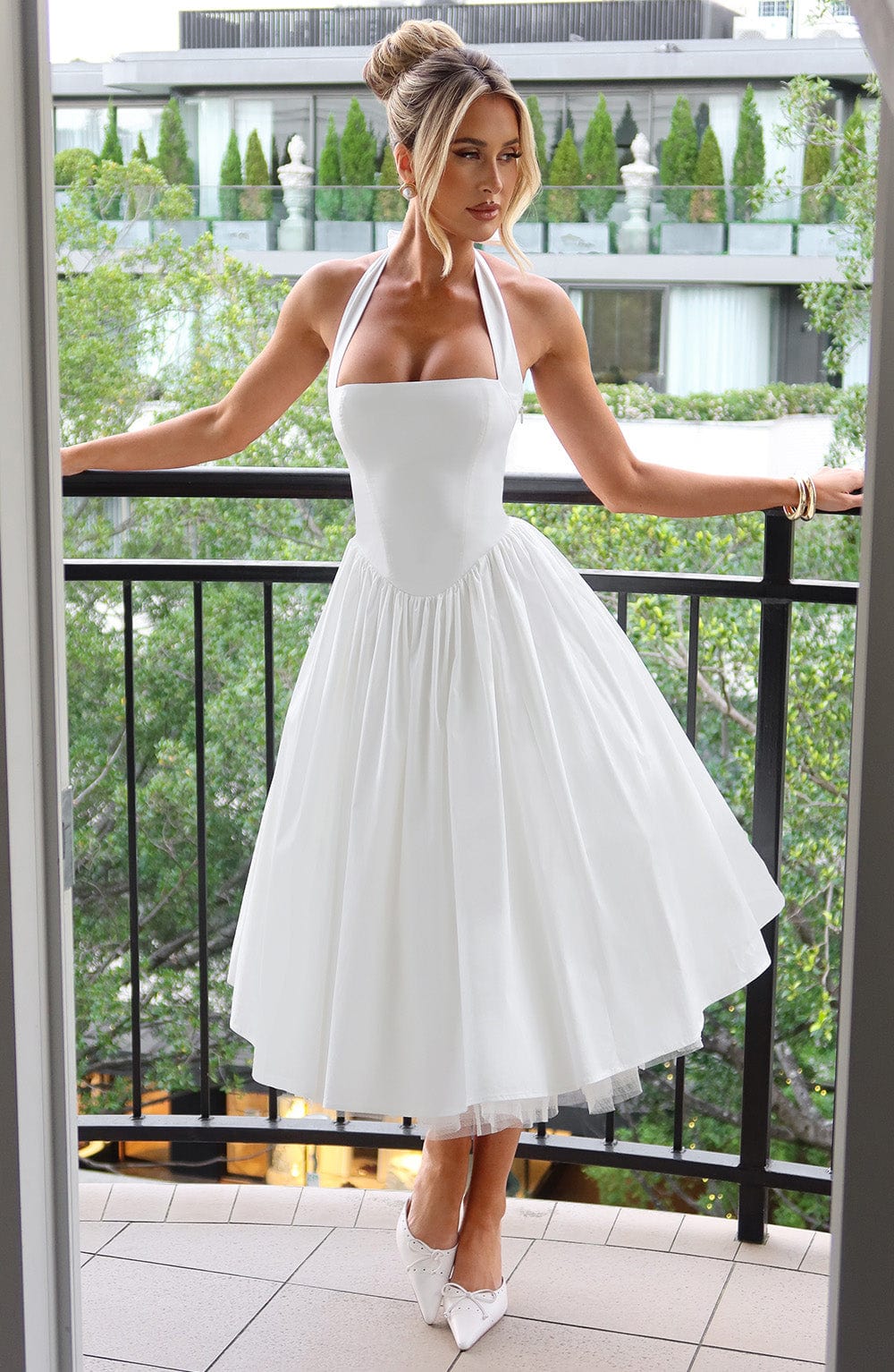 Chic halter-neck midi dress for women, ideal formal party wear with a flattering fit & flare.