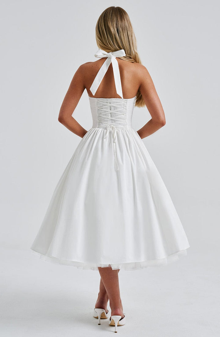 Stylish women's elegant halter neck cocktail dress, a versatile midi length for any event.