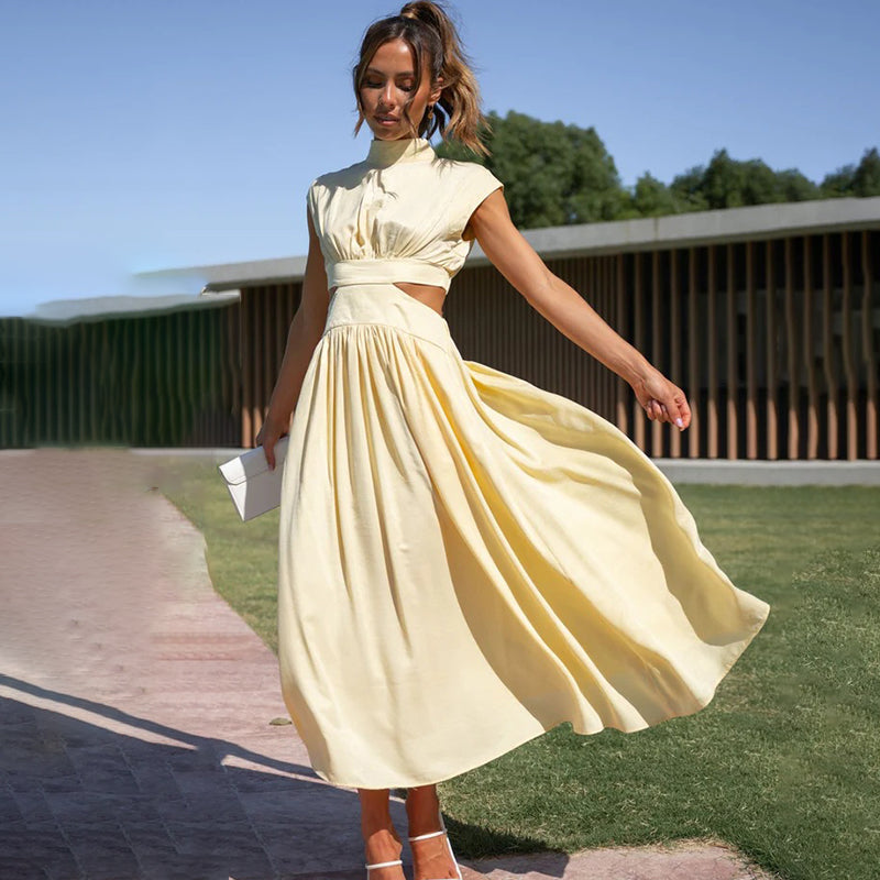 Fashionable women's sleeveless dress, a versatile midi with a flowy skirt, halter neck, and slit.