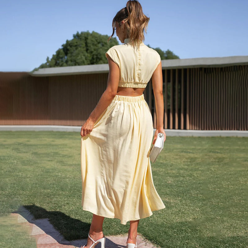 Women's elegant halter neck midi dress with a graceful side slit, ideal for various occasions.