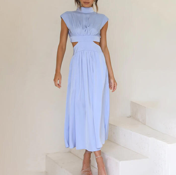 Stylish women's summer dress: a flowy midi with a flattering halter neck and chic side slit detail.