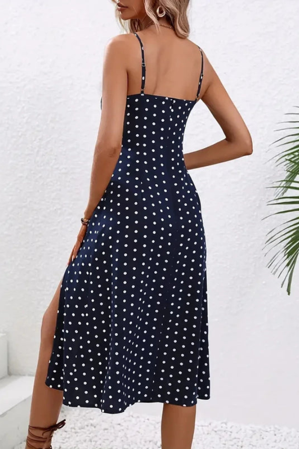 Stylish A-line pleated midi dress for women, featuring a halter neck. Ideal for elegant parties or versatile evening wear.