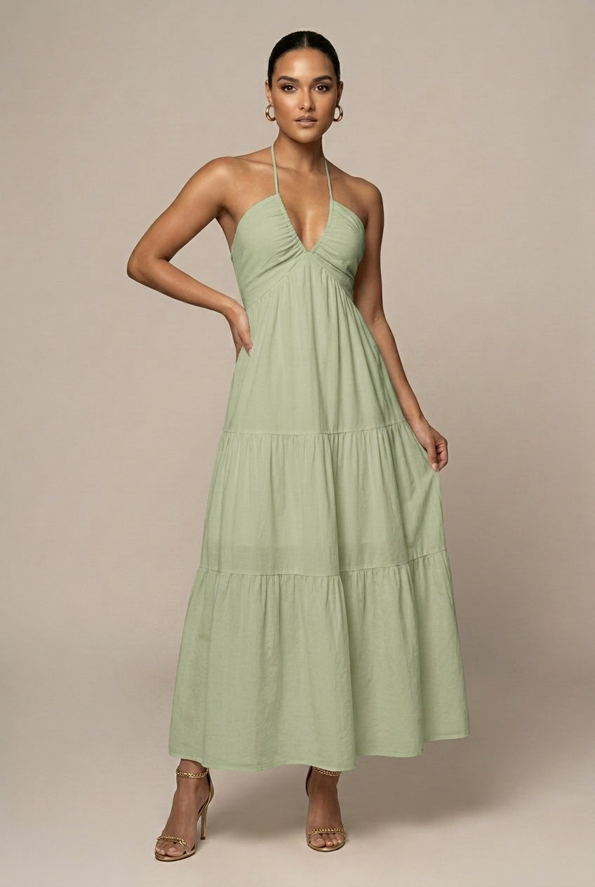 Graceful women's halter neck dress, tiered maxi length, with a delicate ruffle skirt & alluring open back.