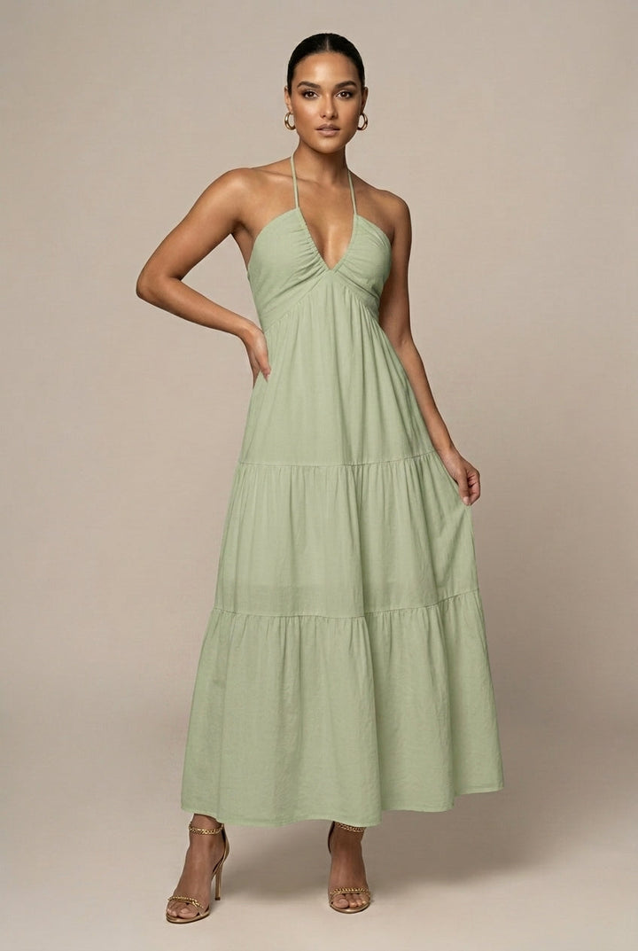 Graceful women's halter neck dress, tiered maxi length, with a delicate ruffle skirt & alluring open back.