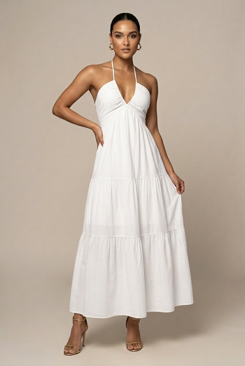 Chic women's tiered maxi dress, halter neck, open back, ideal for summer weddings & elegant gatherings.