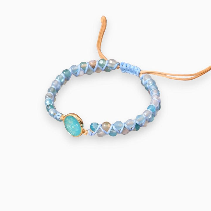 Elegant women's handmade bracelet with dream opal and blue quartz gemstones, a beautiful statement accessory.