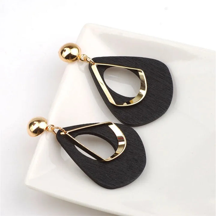 Lightweight handmade wooden teardrop earrings, natural elegant charm for women's unique statement jewelry.
