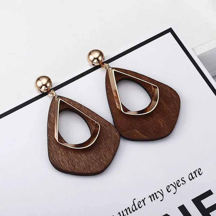 Delicate handmade wooden teardrop earrings, natural elegant charm, lightweight unique jewelry for women.