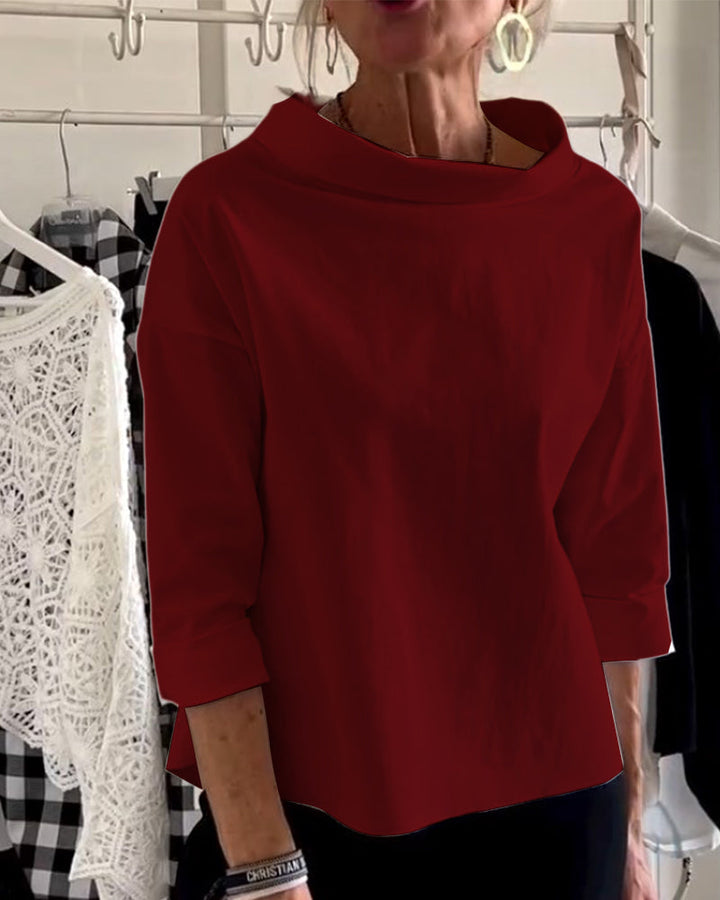 Detail of the cuff on women's elegant long-sleeve high-collar top, comfortable and stylish for everyday.