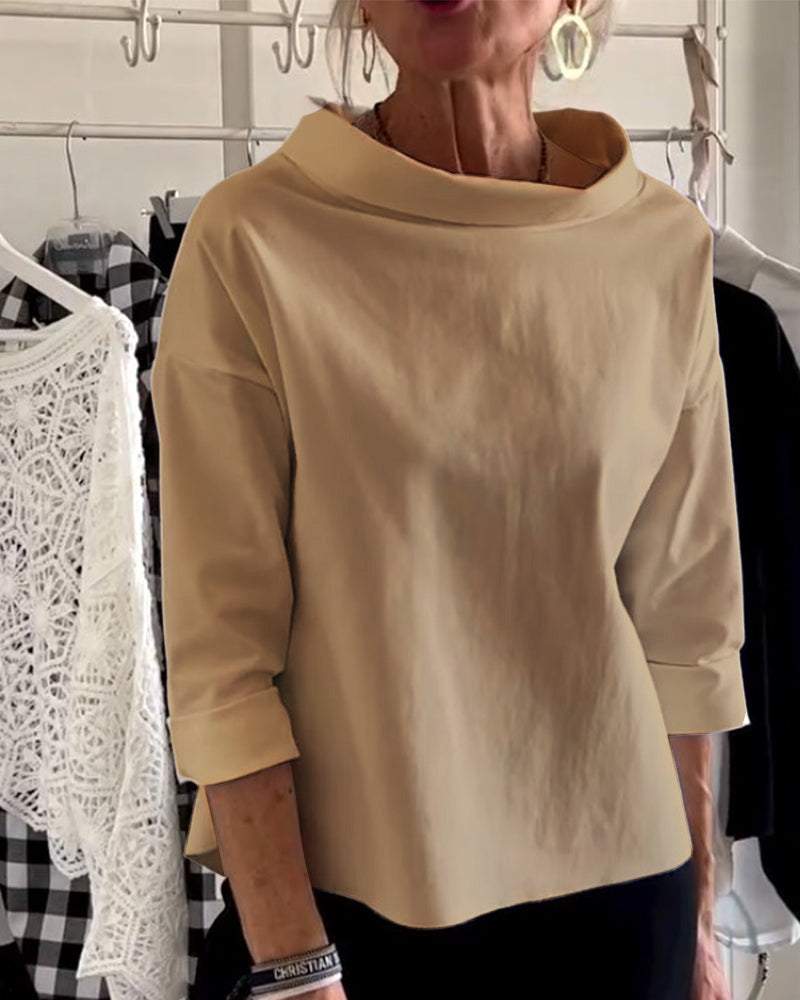 Side view of a women's stylish high-collar long-sleeve top, elegant and versatile for fashion and comfort.